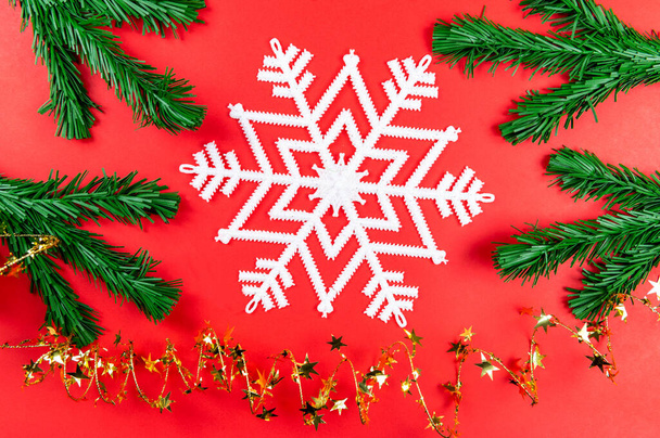 Christmas background with Christmas tree and white snowflake, spiral with Golden stars.  - Фото, изображение