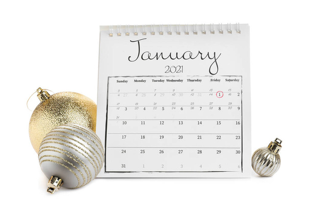Flip calendar and Christmas balls on white background. New Year celebration - Zdjęcie, obraz