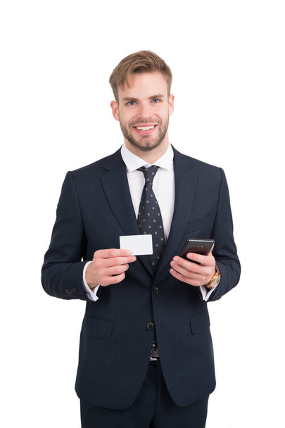 Happy manager in formal style suit hold mobile phone and contact card for copy space, information - 写真・画像