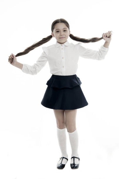 Did on my own. Coolest back to school hairstyles. Gorgeous tails perfect for every day of week. Schoolgirl happy smiling pupil long curly hair. Hairstyle for schoolgirl nice and easy - Foto, Bild