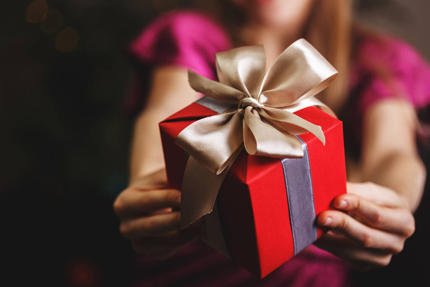 girl holding christmas presents in hands -  happy New Year - Foto, afbeelding