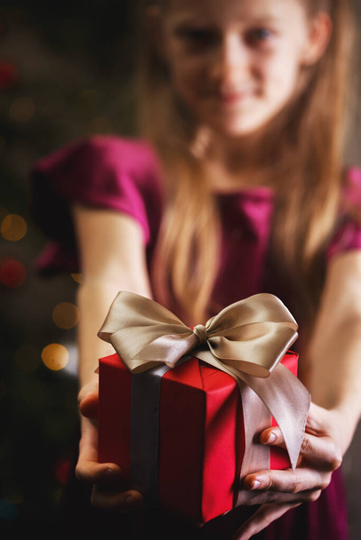 girl holding christmas presents in hands -  happy New Year - Zdjęcie, obraz