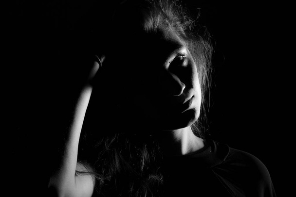Black and white portrait of an Italian young woman on black background - Photo, Image