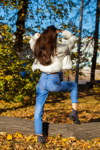 Long beautiful female hair back view - against the background of an autumn park - Fotó, kép