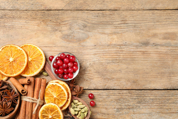 Flat lay composition with mulled wine ingredients on wooden table, flat lay. Space for text - Foto, Bild