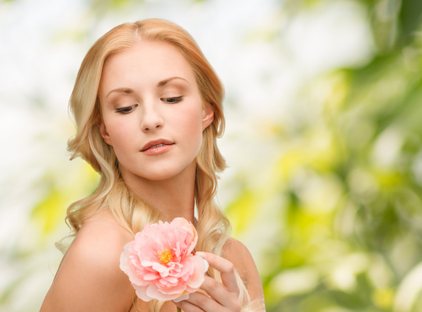 Lovely woman with peony flower - Photo, image