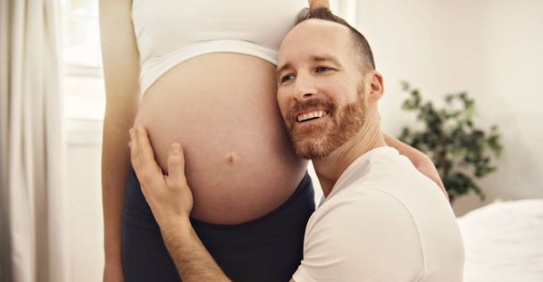 husband on the baby room at home with pregnant woman belly - Zdjęcie, obraz