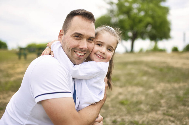 father and his cute daughter having fun outdoors - Photo, Image