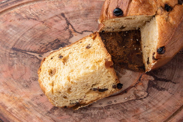 Panettone traditional Italian dessert for Christmas. Wood background. Top view - Photo, Image