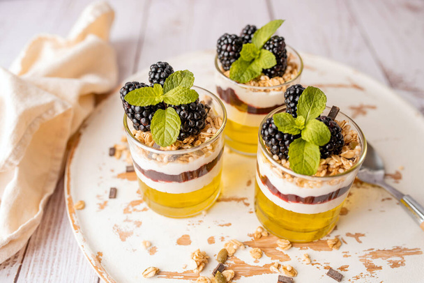 Dessert Parfait glass cup, with lemon jello, yogurt and fresh blackberries. - Фото, зображення