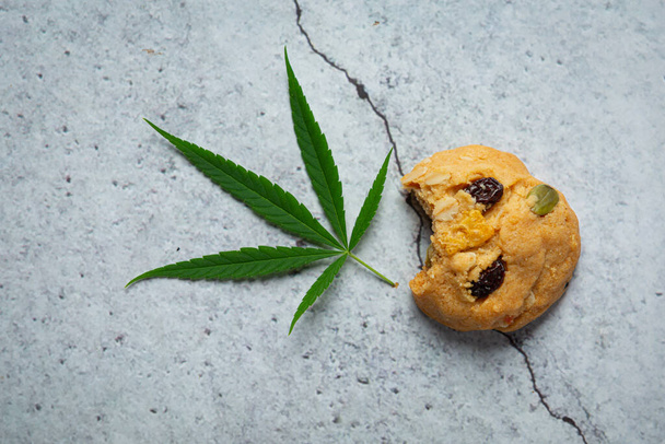 cannabis cookie and cannabis leaf put on floor - Foto, immagini