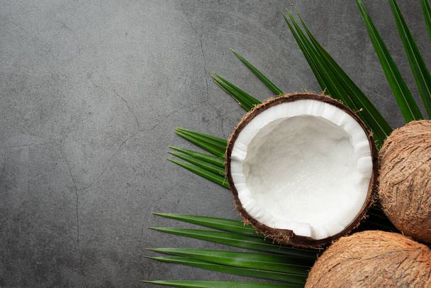 fresh coconuts put on dark background - Foto, afbeelding