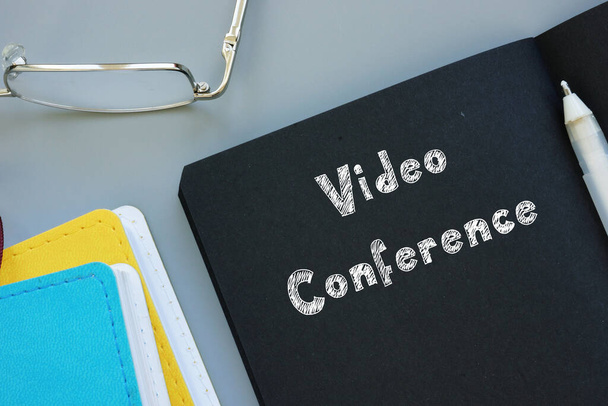 Business concept about Video Conference with phrase on the sheet - Fotografie, Obrázek