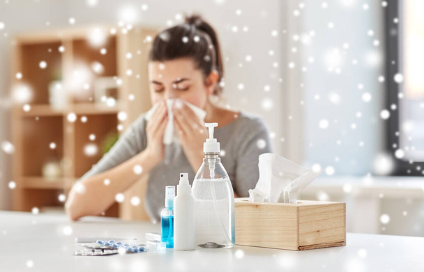 medicines and sick woman blowing nose to wipe - Foto, immagini
