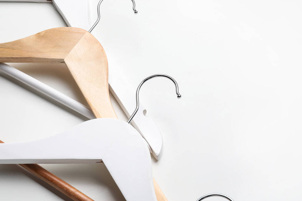 Clothes hangers on light background - Photo, image