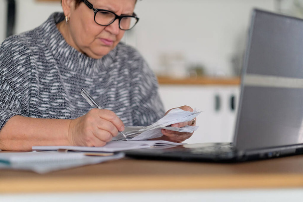 Old people, tax return and home banking. Worried senior lady paying federal taxes, doing family budget. Elderly hispanic person and stress. Concept of money, finance, financial problems - Fotoğraf, Görsel