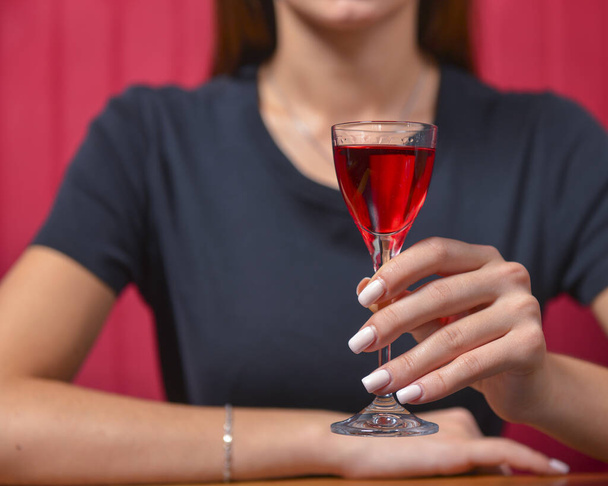 Girl with cocktail, still life concept. Drinking alcohol fruit drink in a restaurant. Eating out concept, young attractive woman drink cocktail. - Φωτογραφία, εικόνα