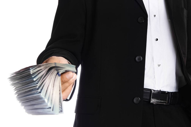 Business man holding money on white background - Fotó, kép