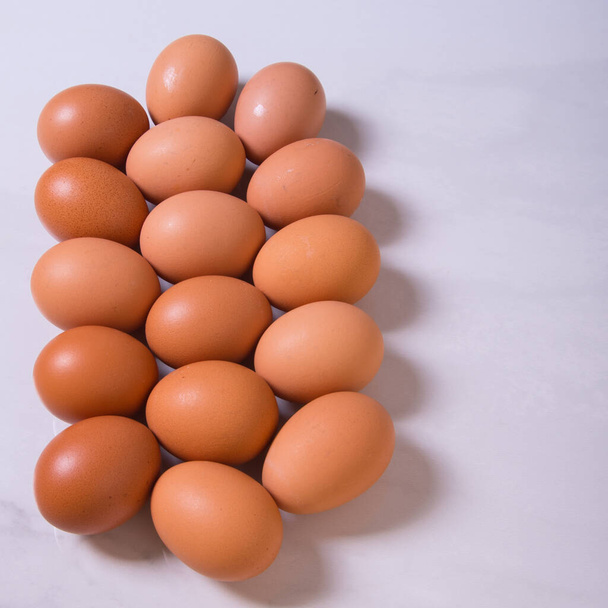 Close-up of fresh brown eggs ,copy space,background,advertising - 写真・画像