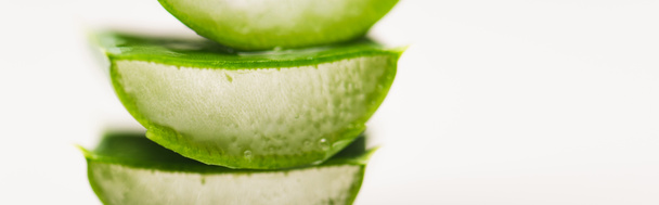 pieces of cut, juicy aloe vera leaves on white surface, banner - Foto, immagini