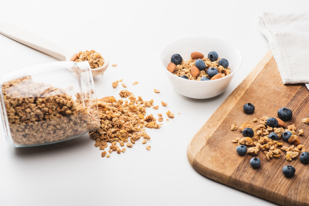 delicious granola with nuts and blueberry on white background - Photo, Image