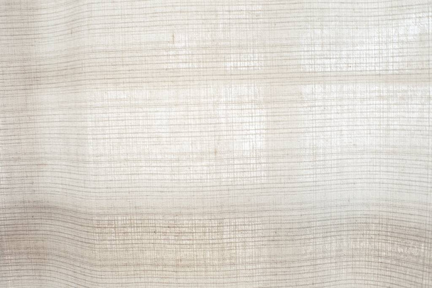 licht natuurlijk linnen textuur Gordijnen selectieve focus achtergrond - Foto, afbeelding