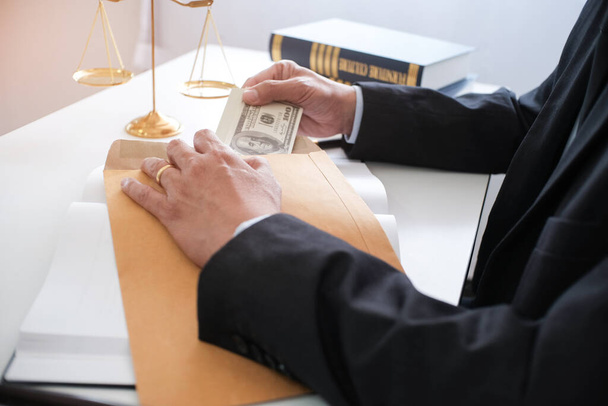 Man giving bribe money in envelope businessmen corruption - Foto, Bild