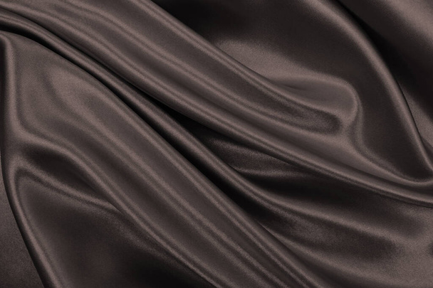 Гладкий элегантный коричневый шелк или атласная текстура может использоваться в качестве абстрактного фона. Роскошный дизайн фона. В Сепии тонизировали. Ретро стиль - Фото, изображение
