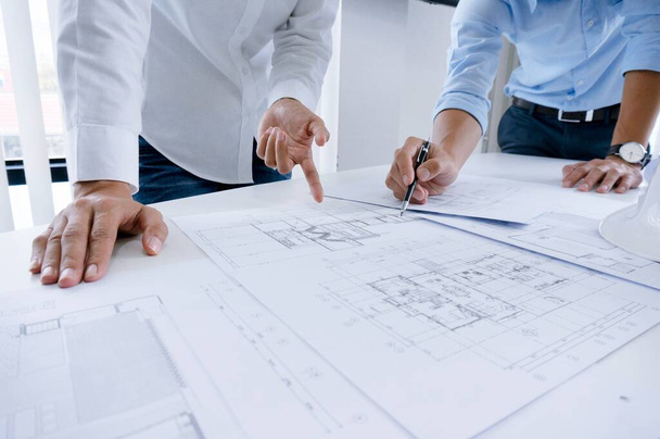 Colleagues interior designer Corporate Achievement Planning Design on blueprint Teamwork Concept with compasses - 写真・画像