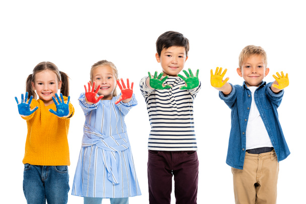 Multiethnic kids smiling while showing messy hands in colorful paint isolated on white - Foto, Bild