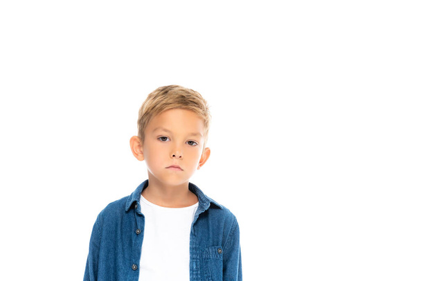 Serious child looking at camera isolated on white - Foto, imagen