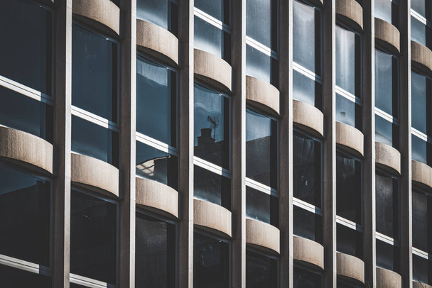 Rows of vertical windows on the facade of an office building - Foto, afbeelding