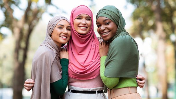 Three Muslim Women In Hijab Posing Hugging Outdoors, Panorama - Zdjęcie, obraz