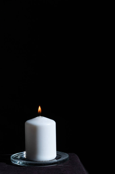burning candle against light blue background  - Photo, Image