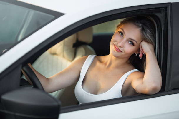 beautiful young female driving a car - Zdjęcie, obraz