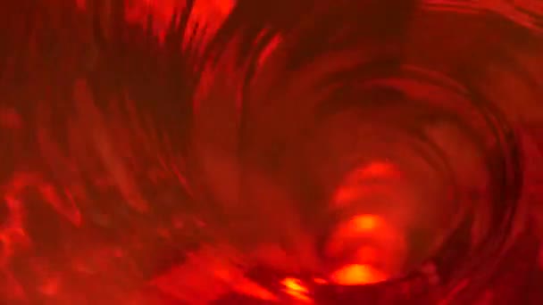 Symbole de l'enfer, de l'enfer et de l'infini. Rouge liquide hypnotique boucle aqua tourbillon tournant. Tourbillon lumineux méditatif. Tunnel spiralé fascinant de fluide cristallin. Gradient d'eau rythmique surréaliste et ardent - Séquence, vidéo