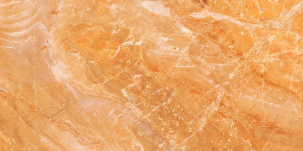 Closeup surface abstract marble pattern at the orange stone floor texture background, luxurious wallpaper with copy space, Emperador breccia natural pattern of marbel, polished quartz slice mineral. - Photo, Image