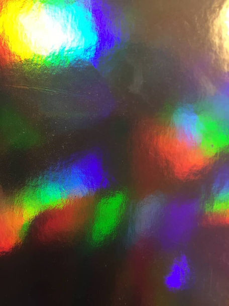 riflessione luminoso iridescente olografico sfondo modello texture sfondo concetto superficie olografica foglio pastello. Sfondo reale dell'ologramma di azione astratta rugosa - Foto, immagini