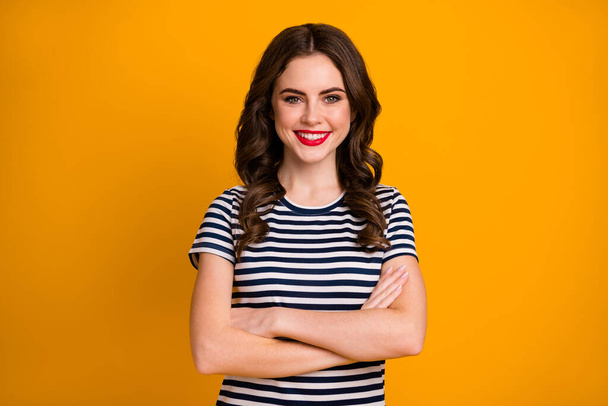 Photo of charming business lady in striped fashionable clothing holding hands folded isolated over bright color yellow background - Φωτογραφία, εικόνα