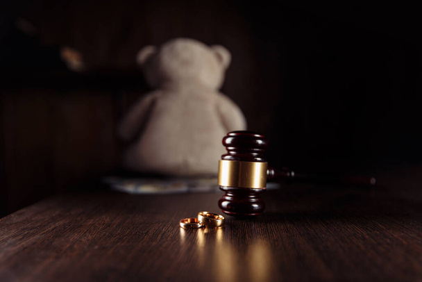 Alimony payment. Dollar banknotes, judge gavel and teddy bear. Family divorce and alimony concept - Photo, Image