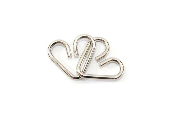 metal puzzle in the form of hearts on a white background. - Photo, Image