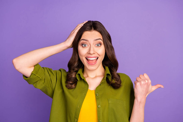 Close-up portrait of her she nice attractive lovely cheerful cheery glad brown-haired girl demonstrating new novelty ad isolated over bright vivid shine vibrant lilac violet purple color background - Foto, immagini