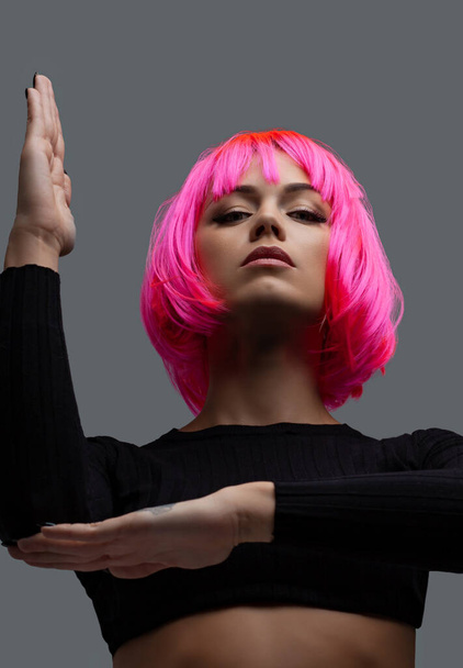 Attractive woman with pink neon hair. - Foto, Imagem