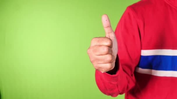  man hand showing a thumb-up on green background  - Кадры, видео