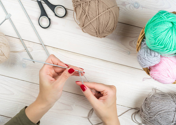 Knitting. Hand Crochet. Female hand knit hook. Top view. Knitting in woman hands - Valokuva, kuva