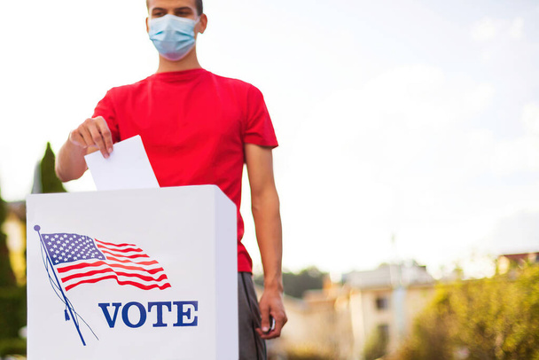 Man voting outside with face mask - Photo, Image