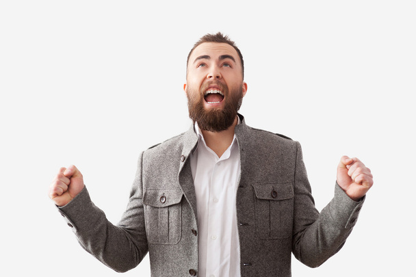 Bearded man screaming with hands up - Foto, afbeelding