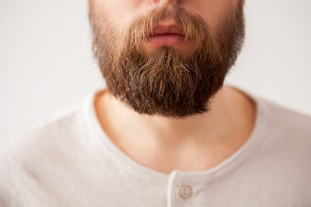 Close-up cropped image of bearded mens face - Foto, imagen