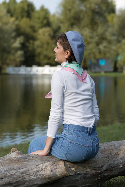 Young woman in the park. Cute girl portrait in french style. - Foto, Imagem
