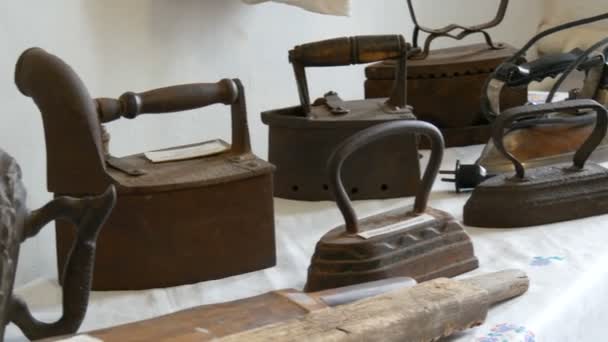 Old cast iron irons on display in the museum - Footage, Video